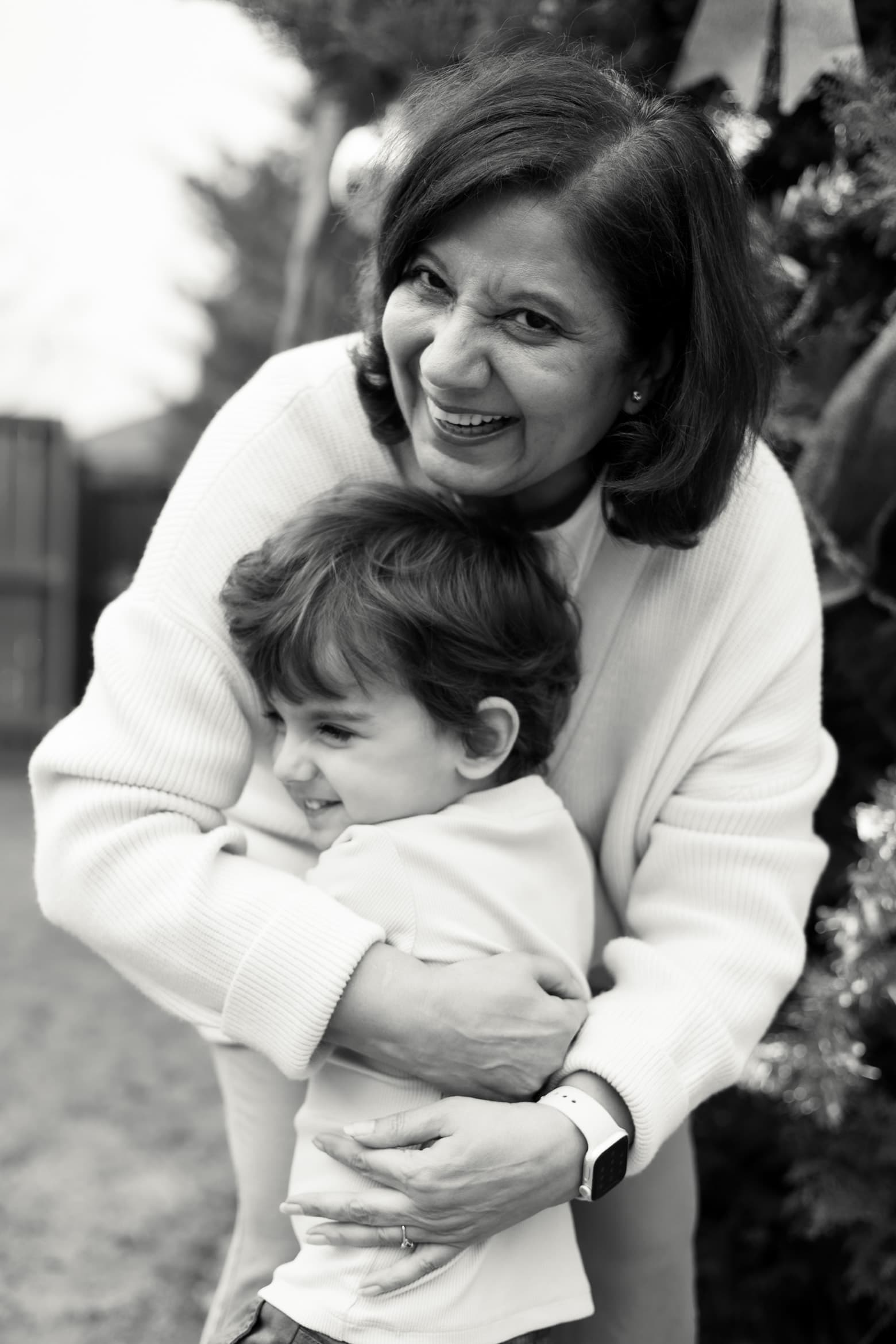 Grandmother embracing grandson